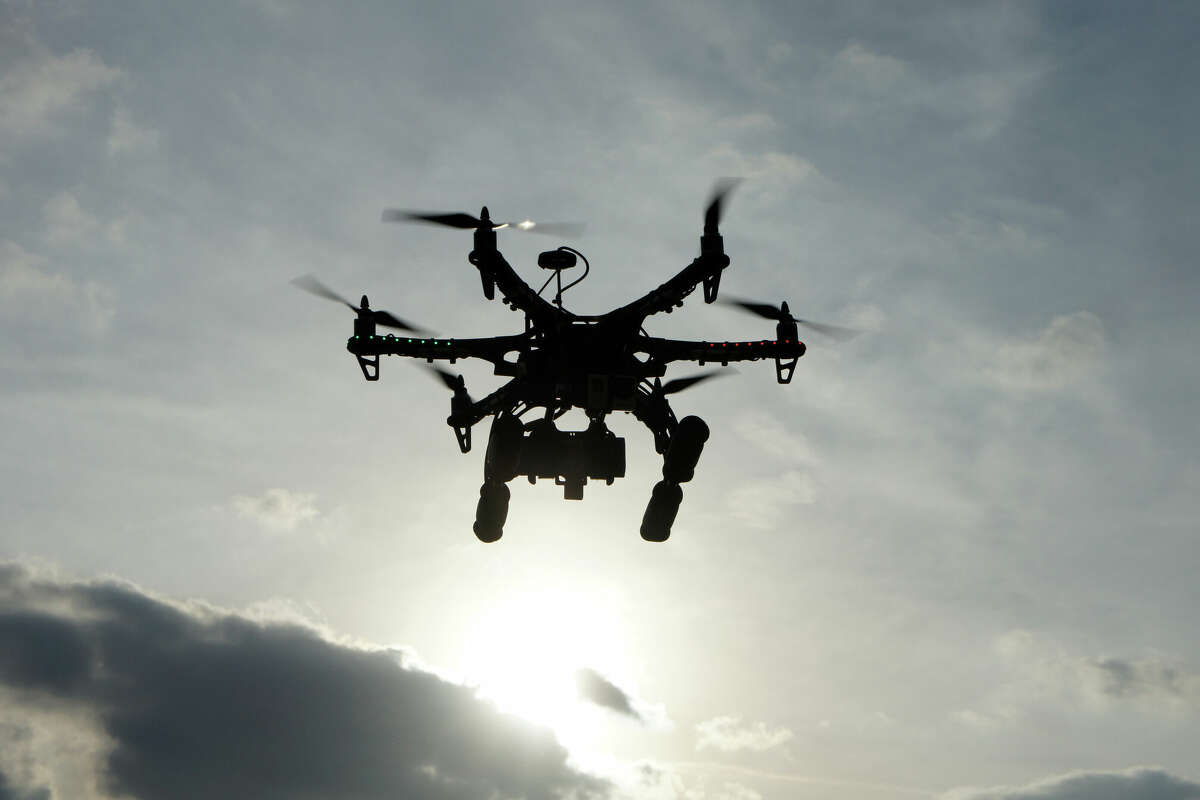 A drone in flight. The Texas company that produced the show Dec. 21 that left a boy injured has been barred by the FAA.