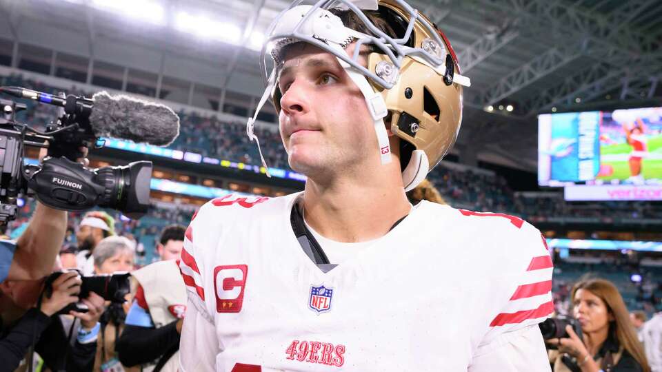 San Francisco 49ers quarterback Brock Purdy (13) walks on the field after an NFL football game against the Miami Dolphins, Sunday, Dec. 22, 2024, in Miami Gardens, Fla. (AP Photo/Doug Murray)