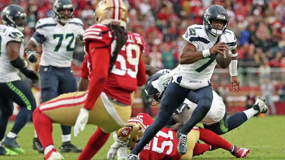 Seattle Seahawks’ Geno Smith rushes for the game-winning 13-yard touchdown in final minute against San Francisco 49ers during Niners’ 20-17 loss in NFL game at Levi’s Stadium in Santa Clara, Calif., on Sunday, November 17, 2024.