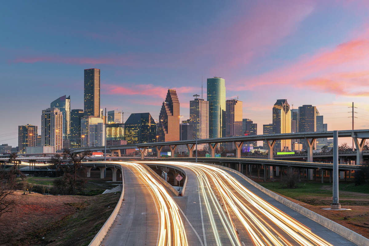 Houston, Texas, USA downtown skyline over the highways at dusk.