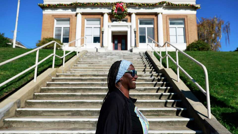 Marie Harvey walks by South San Francisco City Hall to get lunch near her apartment in South San Francisco, California Monday, Dec. 9, 2024.