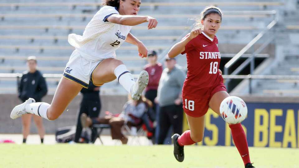 California Golden Bears Karlie Lema (12) takes a shot at goal against Stanford Cardinal defender Avani Brandt (18) during a women’s soccer game at Edwards Stadium in Berkeley, Calif., Friday, Nov. 4, 2022. The game ended in a 1-1 draw.