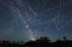 A half hour of long-exposure photographs shows streaks of light where fast-moving satellites passed by the photographer’s position at the latitude of 51 degrees north.