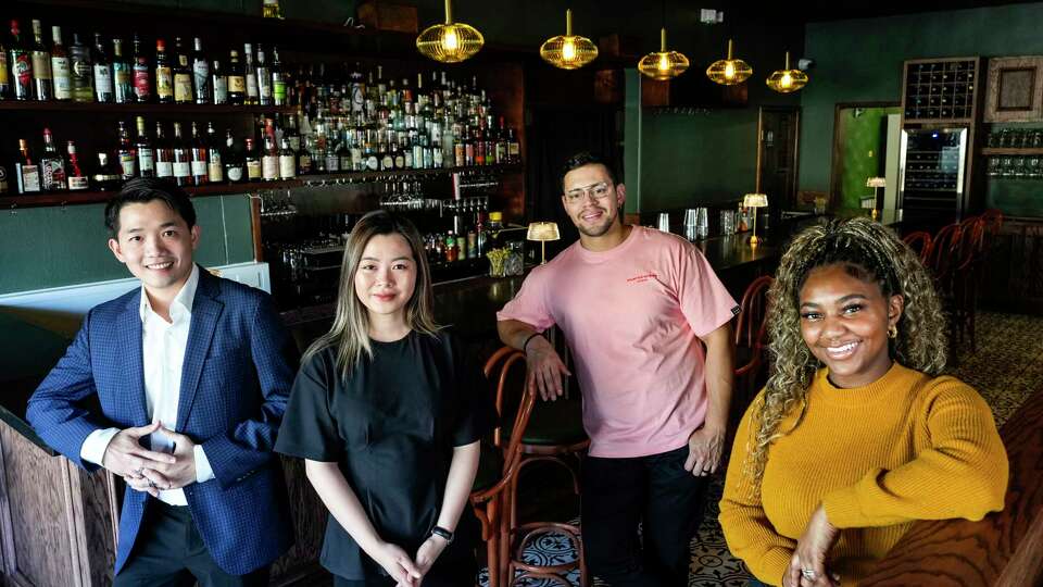 Alora partners Louis Quy, his wife Ngoc Tran, chefs Diego Ponce and his wife Makayla Ponce pose for a portrait in restaurant on Monday, Dec. 30, 2024 in Houston. Alora is a new Peruvian-Vietnamese restaurant opening in Montrose.