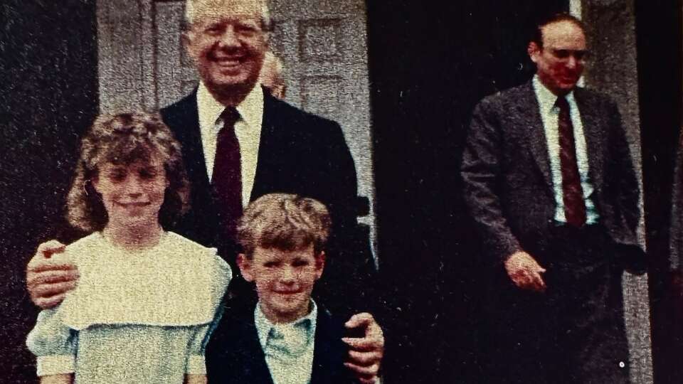 ONE TIME USE ONLY FOR CARTER1231: The author and her brother stand with President Jimmy Carter at Maranatha Baptist Church in Plains, GA in 1985.