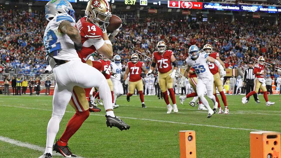 San Francisco 49ers wide receiver Ricky Pearsall (14) makes the touchdown catch against Detroit Lions safety Brian Branch (32) in the first quarter of an NFL game at Levi’s Stadium in Santa Clara, Calif., on Monday, Dec. 30, 2024.