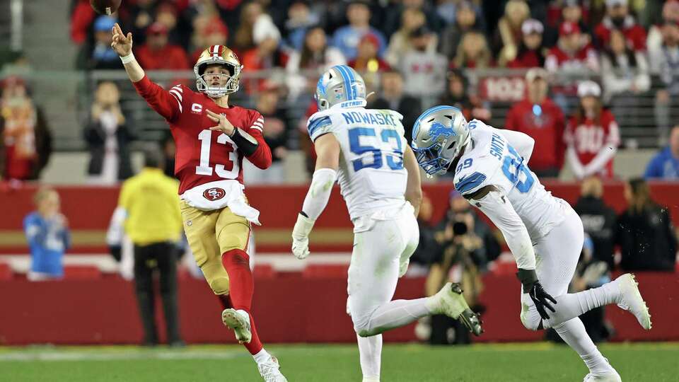 San Francisco 49ers’ Brock Purdy throws a pass against Detroit Lions’ Trevor Nowaske and Za’Darius Smith during Niners’ 40-34 loss in NFL game at Levi’s Stadium in Santa Clara, Calif., on Monday, December 30, 2024.