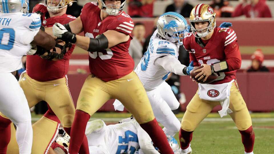 San Francisco 49ers quarterback Brock Purdy (13) breaks a tackle and soon after is sacked by the Detroit Lions in the fourth quarter of an NFL game at Levi’s Stadium in Santa Clara, Calif., on Monday, Dec. 30, 2024. The Lions won 40-34.