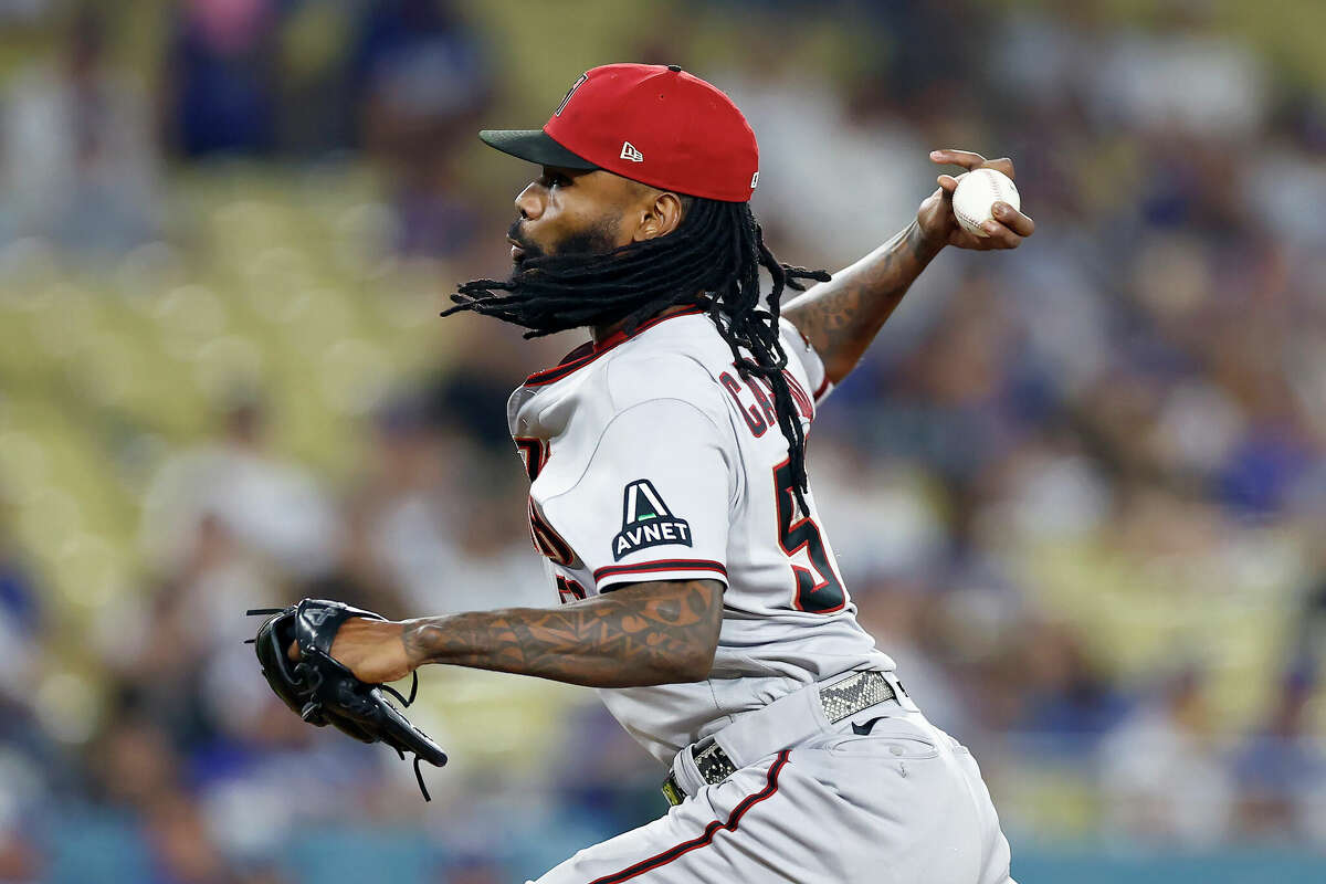 LOS ANGELES, CALIFORNIA - OCTOBER 07: Miguel Castro #50 of the Arizona Diamondbacks pitches in the eighth inning against the Los Angeles Dodgers during Game One of the Division Series at Dodger Stadium on October 07, 2023 in Los Angeles, California. (Photo by Ronald Martinez/Getty Images)