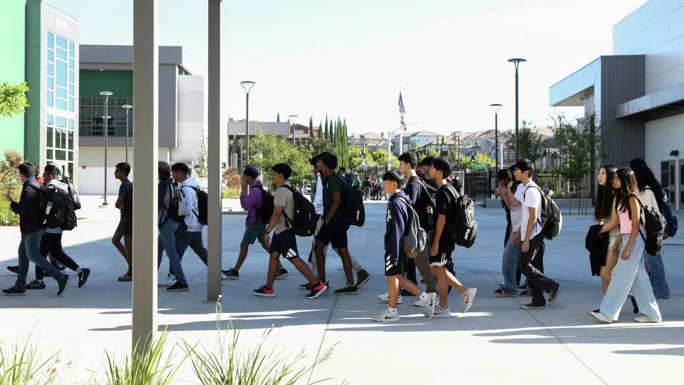 Students make their way to their first period class during the first day of school at the newly-constructed Emerald High School in Dublin, Calif. Tuesday, Aug. 13, 2024.