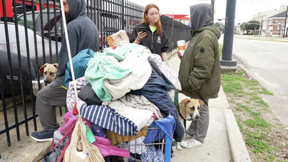 Coalition for the Homeless outreach worker, Kris Donaldson, talks with Carrie Campbell of Houston in Midtown during the annual national point-in-time count of the homeless on Friday, Jan. 26, 2024 in Houston, TX.