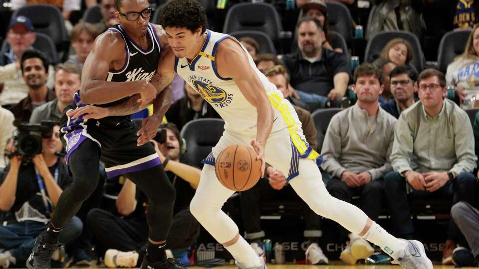 Golden State Warriors forward Gui Santos (15) against Sacramento Kings forward Isaiah Crawford (24) in the fourth quarter during an NBA preseason game at Chase Center in San Francisco, Friday, Oct. 11, 2024. The Warriors won 109-106.