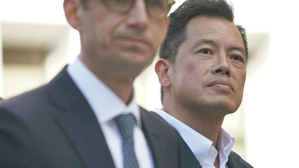 Former SFPD commander Paul Yep stands in the background after voicing support for San Francisco mayoral candidate Daniel Lurie at St. Mary’s Square in San Francisco, California on Monday, February 26, 2024.