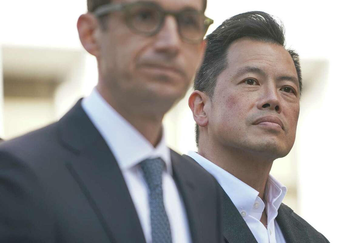 Former SFPD commander Paul Yep stands in the background after voicing support for San Francisco mayoral candidate Daniel Lurie at St. Mary’s Square in San Francisco, California on Monday, February 26, 2024.