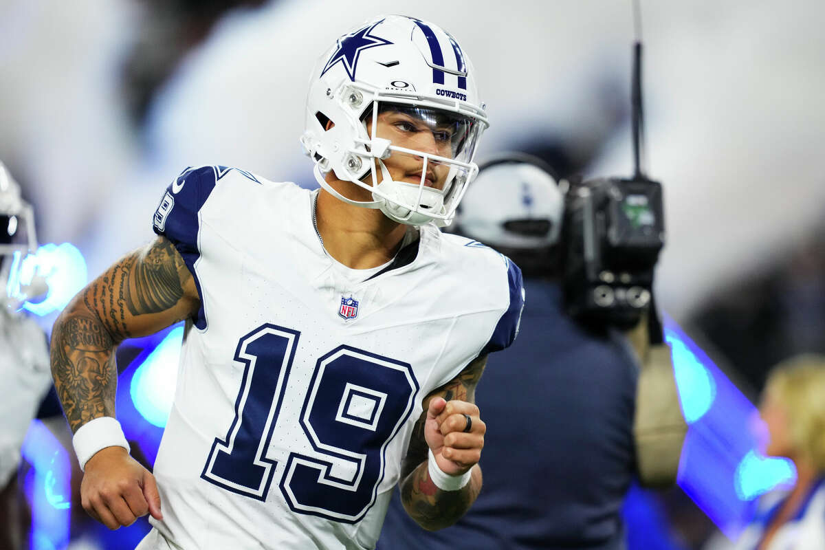 Trey Lance #19 of the Dallas Cowboys runs out of the tunnel prior to an NFL football game against the Cincinnati Bengals at AT&T Stadium on Dec. 9, 2024 in Arlington, Texas.