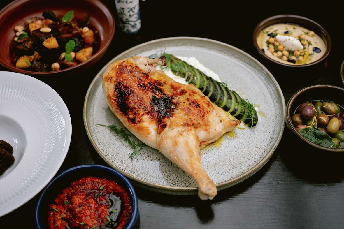 Saffron-marinated roast chicken with charred Persian cucumbers at Amara in Belmont.