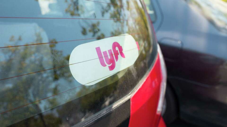 Sticker for Lyft on the back of a Lyft ride sharing vehicle in the Silicon Valley town of Santa Clara, California, August 17, 2017. (Photo via Smith Collection/Gado/Getty Images).