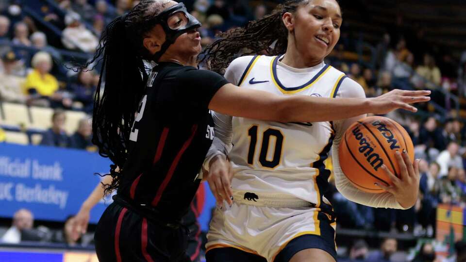 Stanford Cardinal guard Jzaniya Harriel (32) reaches for the ball against California Golden Bears guard Lulu Twidale (10) in the first half of an ACC women’s college basketball game at Haas Pavilion in Berkeley, Calif., on Friday, Dec. 13, 2024.