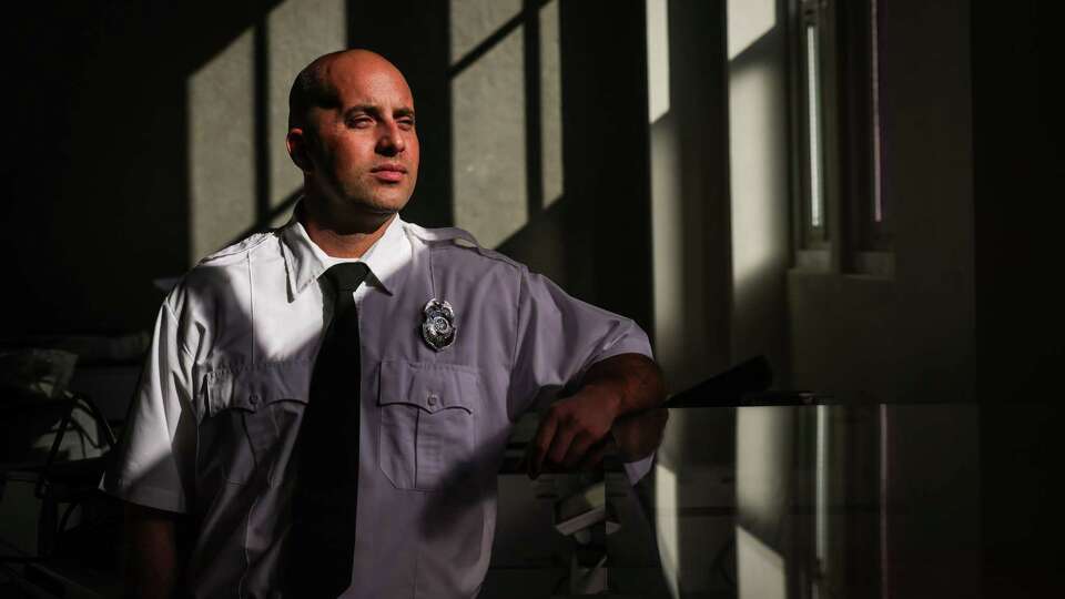 SF firefighter Matt Vann who sustained major brain injury on the job in 2020 stands for a portrait at the San Francisco Fire Department Headquarters in San Francisco on Thursday, Dec. 5, 2024. He no longer works fighting fires.