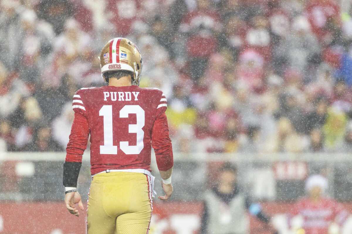 San Francisco 49ers quarterback Brock Purdy (13) in the rain during a NFL game between the Los Angeles Rams and the San Francisco 49ers on Dec. 12, 2024 at Levi's Stadium in Santa Clara, Calif.