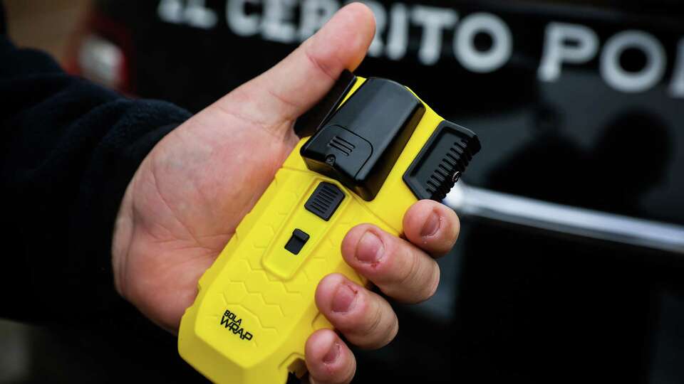 Sergeant David Wentworth demonstrates how to use the BolaWrap at the El Cerrito Police Station in El Cerrito, Calif., on Wednesday, Nov. 15, 2023. BolaWrap is a high-tech lasso that many local police departments are using to restrain suspects.