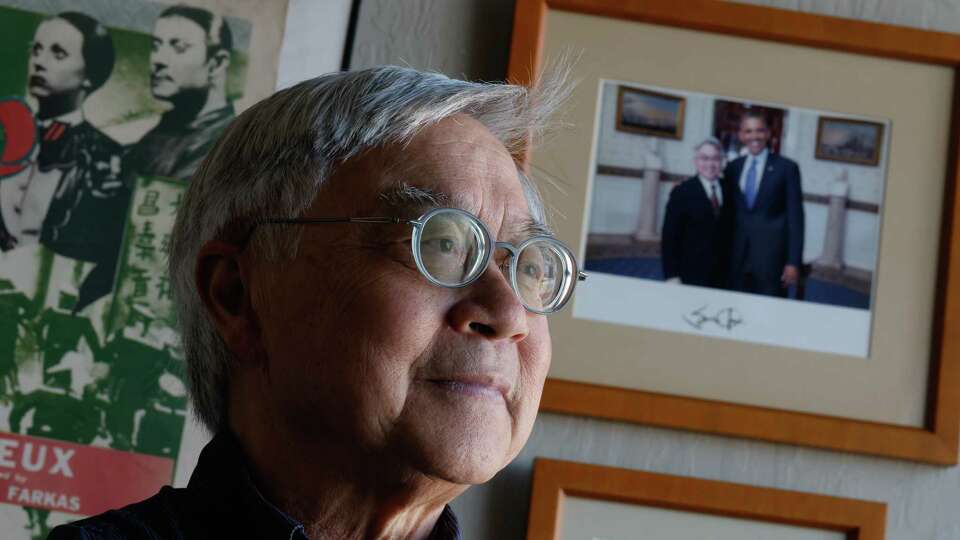 Stephen Gong, executive director of the Center for Asian American Media, stands for a portrait in his office at the Center for Asian American Media next to a photo of Gong and President Barack Obama from a visit Gong took to the White House during a gathering of national Asian American leaders for a program on Friday, November 8, 2024 in San Francisco, Calif.