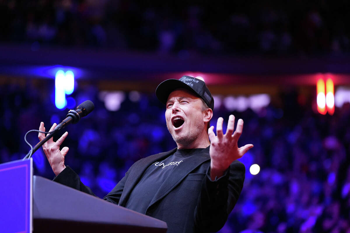 Elon Musk gestures on stage at a Donald Trump rally at Madison Square Garden in New York on Sunday, October 27, 2024.