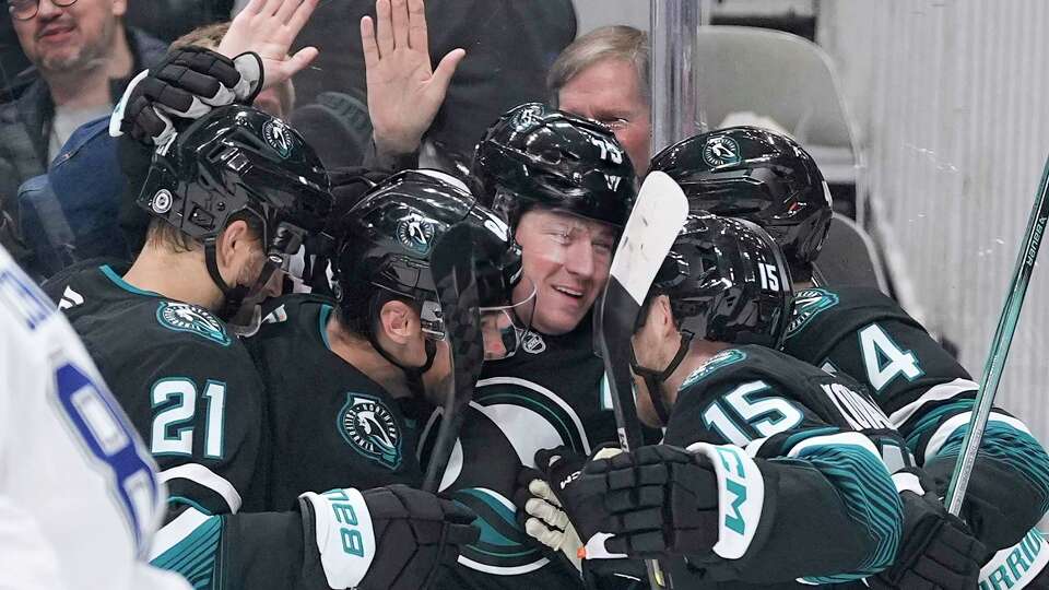 San Jose Sharks center Tyler Toffoli, center, celebrates with teammates after scoring a gaol against the Tampa Bay Lightning during the first period of an NHL hockey game in San Jose, Calif., Thursday, Jan. 2, 2025.