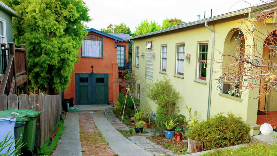 View down driveway of a large home towards a presumed Accessory Dwelling Unit (ADU), commonly known as an In Law unit in a a converted garage in Berkeley, California, December 18, 2018.