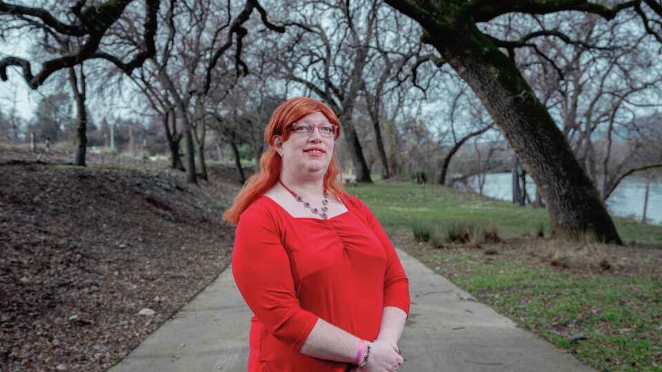 Bobbie Simpson poses for a portrait near the Sundial Bridge in Redding, Tuesday, December 31, 2024. Up and down California, at least 84 candidates supported by right-wing groups like Moms for Liberty, the California Family Council and Reform California won their November contests. The results flipped four school boards to the right and maintained conservative majorities on others, including the Chino Valley board that has pressed forward with attempts to forcibly out trans and gender-nonconforming children. Up in Shasta County, Bobbie Simpson (she/her), an openly transgender parent elected to Gateway Unified’s school board, is pushing against a political barnstorm.