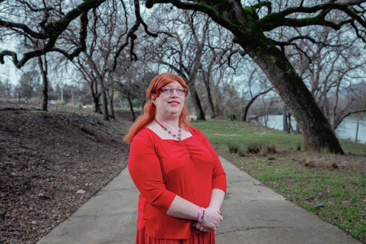 Bobbie Simpson poses for a portrait near the Sundial Bridge in Redding, Tuesday, December 31, 2024. Up and down California, at least 84 candidates supported by right-wing groups like Moms for Liberty, the California Family Council and Reform California won their November contests. The results flipped four school boards to the right and maintained conservative majorities on others, including the Chino Valley board that has pressed forward with attempts to forcibly out trans and gender-nonconforming children. Up in Shasta County, Bobbie Simpson (she/her), an openly transgender parent elected to Gateway Unified’s school board, is pushing against a political barnstorm.