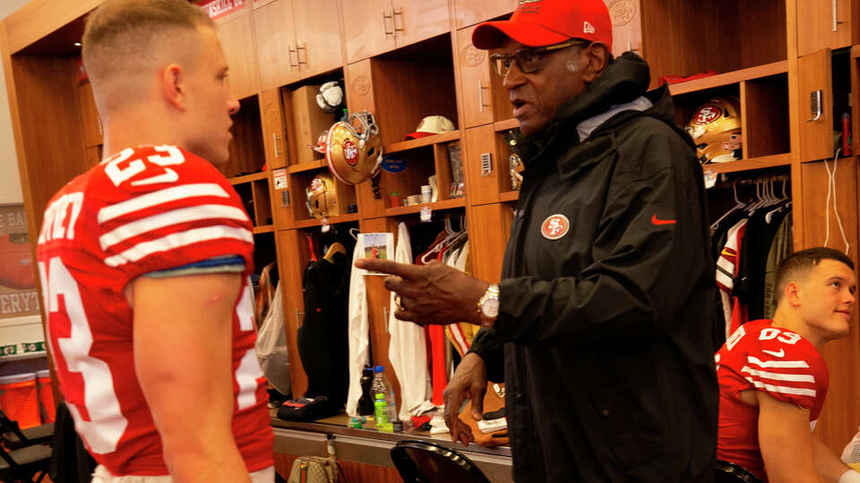 SANTA CLARA, CA - JANUARY 14: Christian McCaffrey #23 and Bobby Turner of the San Francisco 49ers in the locker room before the NFC Wild Card playoff game against the Seattle Seahawks at Levi's Stadium on January 14, 2023 in Santa Clara, California. The 49ers defeated the Seahawks 41-23. (Photo by Michael Zagaris/San Francisco 49ers/Getty Images)