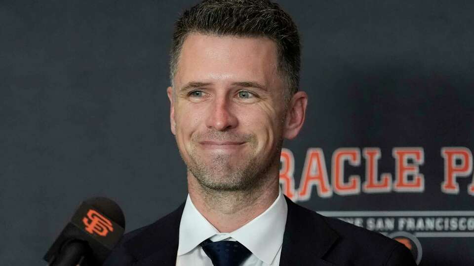 San Francisco Giants president of baseball operations Buster Posey smiles during a news conference introducing new shortstop Willy Adames, Thursday, Dec. 12, 2024, in San Francisco. (AP Photo/Jeff Chiu)