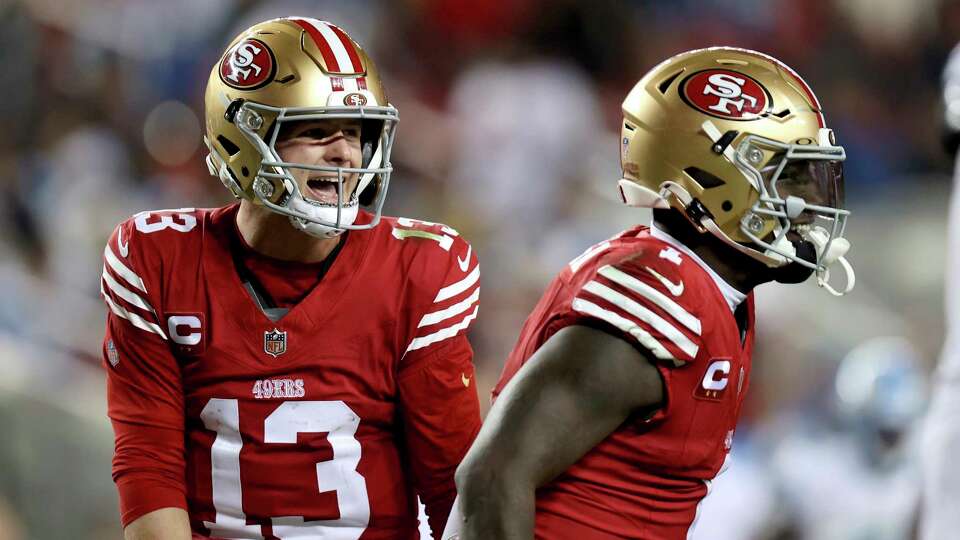 San Francisco 49ers quarterback Brock Purdy (13) and wide receiver Deebo Samuel Sr. (1) celebrate during an NFL football game against the Detroit Lions, Monday, Dec 30, 2024, in Santa Clara, Calif. (AP Photo/Scot Tucker)