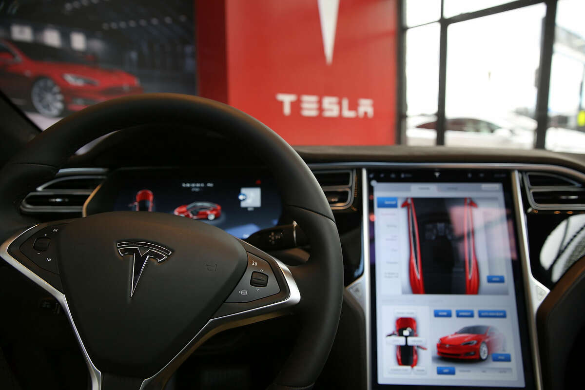 The inside of a Tesla vehicle is viewed as it sits parked in a new showroom and service center in Red Hook, Brooklyn, on July 5, 2016 in New York City.