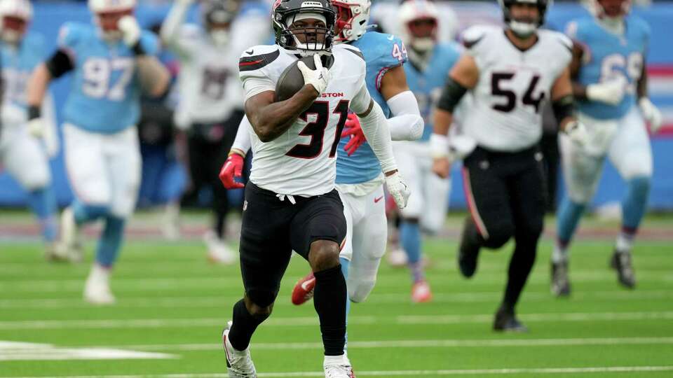 Houston Texans running back Dameon Pierce (31) runs for a 92-yard touchdown during the first half of an NFL football game Sunday, Jan. 5, 2025, in Nashville, Tenn.