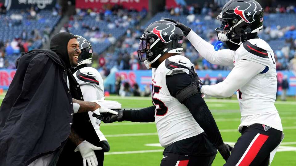 Houston Texans defensive end Derek Barnett, center, celebrates after returning a fumble for a 36-yard touchdown during the second half of an NFL football game Sunday, Jan. 5, 2025, in Nashville, Tenn. Barnett returned it