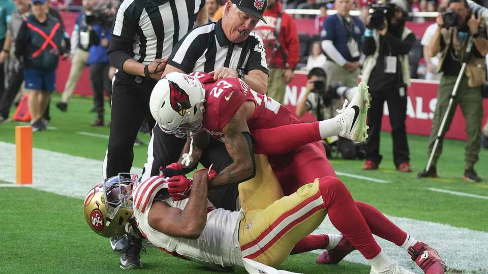 Arizona Cardinals cornerback Sean Murphy-Bunting (23) scuffles with San Francisco 49ers wide receiver Jauan Jennings (15) during the first half of an NFL football game in Glendale, Ariz., Sunday, Jan. 5, 2025. (AP Photo/Ross D. Franklin)