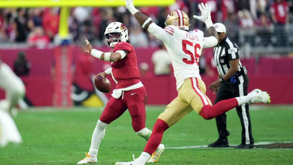 Arizona Cardinals quarterback Kyler Murray (1) looks to pass under pressure from San Francisco 49ers defensive end Leonard Floyd (56) during the second half of an NFL football game in Glendale, Ariz., Sunday, Jan. 5, 2025. (AP Photo/Ross D. Franklin)