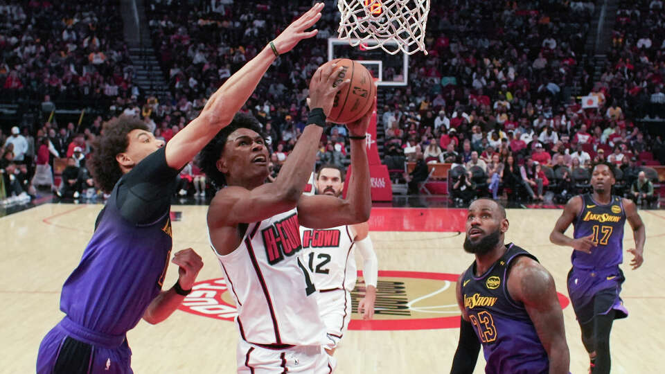 Houston Rockets forward Amen Thompson (1) shoots against Los Angeles Lakers center Jaxson Hayes (11) during the first half of an NBA basketball game, Sunday, Jan. 5, 2025, at Toyota Center.