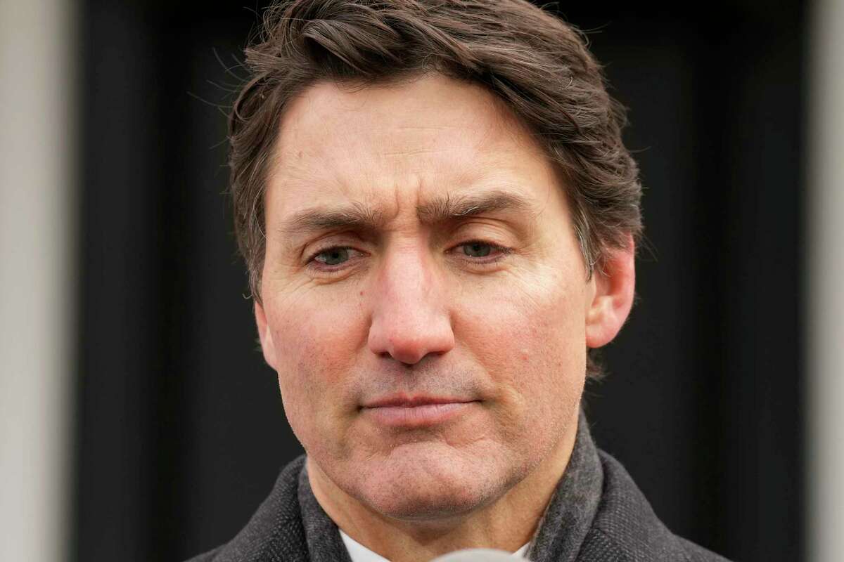 Prime Minister Justin Trudeau makes an announcement outside Rideau Cottage in Ottawa on Monday, Jan. 6, 2025. (Adrian Wyld/The Canadian Press via AP)