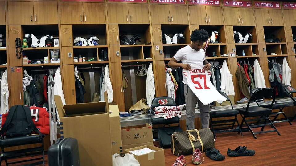 After possibly playing his final game with the franchise, San Francisco 49ers’ Charvarius Ward folds a Dre Greenlaw jersey as he cleans out his locker at Levi’s Stadium in Santa Clara, Calif., on Monday, January 6, 2025.