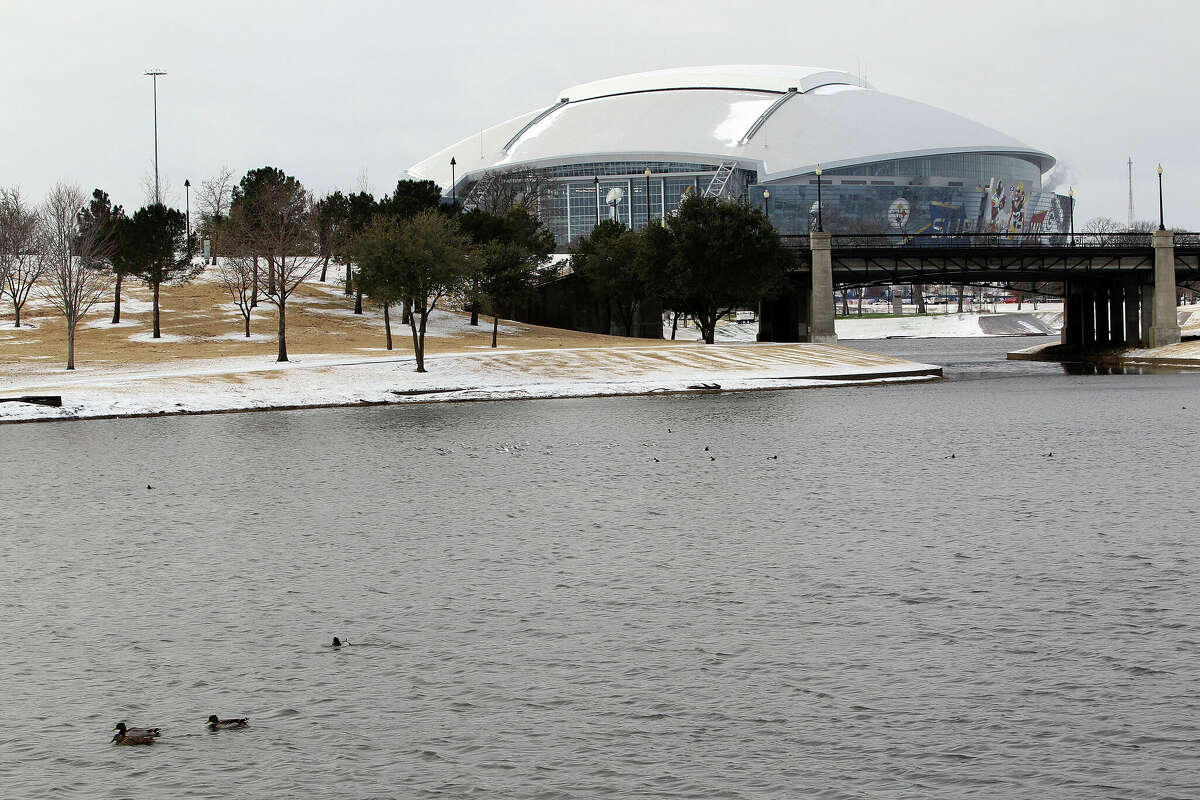 ARLINGTON, TX - FEBRUARY 01: A view of Cowboys Stadium with snow on the roof before Super Bowl XLV Media Day on February 1, 2011 in Arlington, Texas. The Dallas area was hit with winter weather late yesterday evening causing road and school closures in the area. (Photo by Michael Heiman/Getty Images)