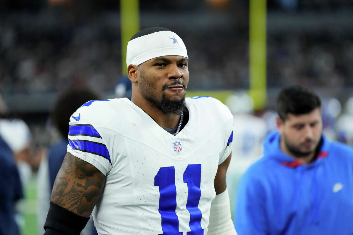 Dallas Cowboys linebacker Micah Parsons walks on the sideline during the first half of an NFL football game against the Tampa Bay Buccaneers in Arlington, Texas, Sunday, Dec. 22, 2024. (AP Photo/Jeffrey McWhorter)