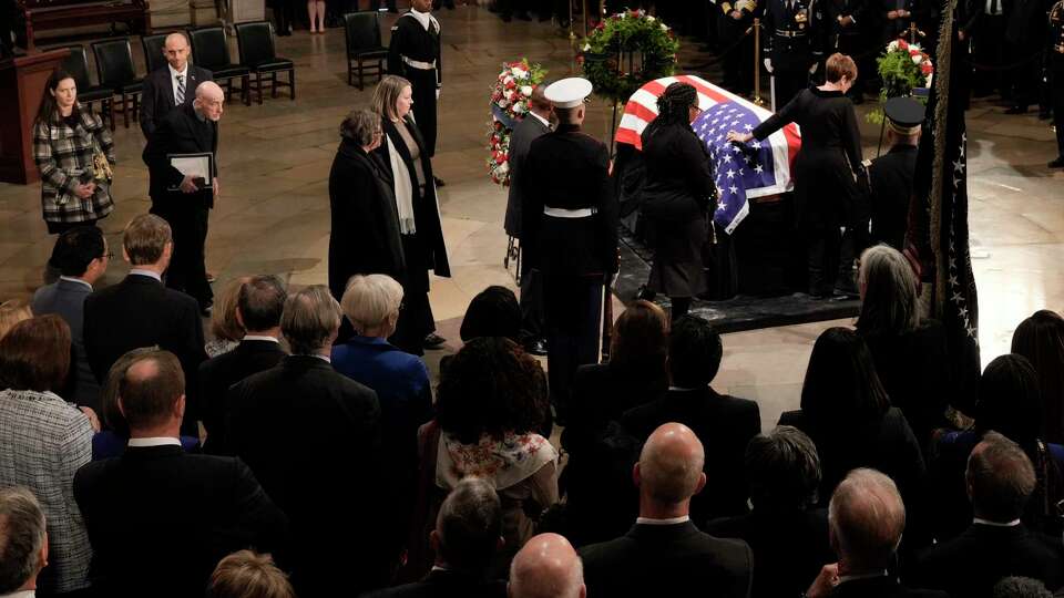 Members of the Carter family pay their respects as the flag-draped casket of former President Jimmy Carter lies in state at the U.S. Capitol, Tuesday, Jan. 7, 2025, in Washington. Carter died Dec. 29 at the age of 100.