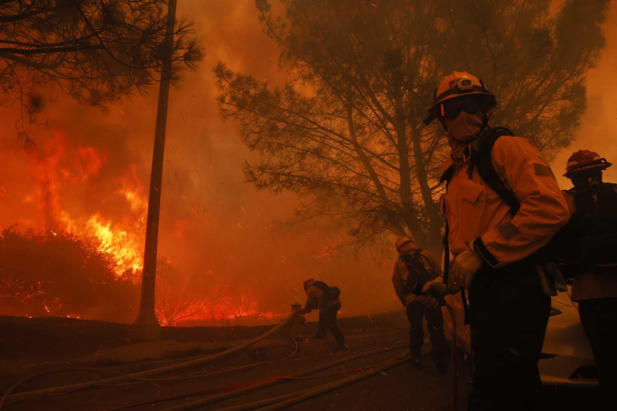 See photos of fire, smoke and flight as wildfires race across Southern ...