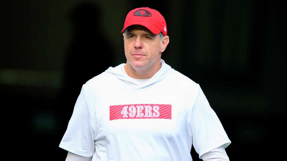 San Francisco 49ers quarterbacks coach Brian Griese walks onto the field before an NFL football game against the Miami Dolphins, Sunday, Dec. 22, 2024, in Miami Gardens, Fla. (AP Photo/Doug Murray)