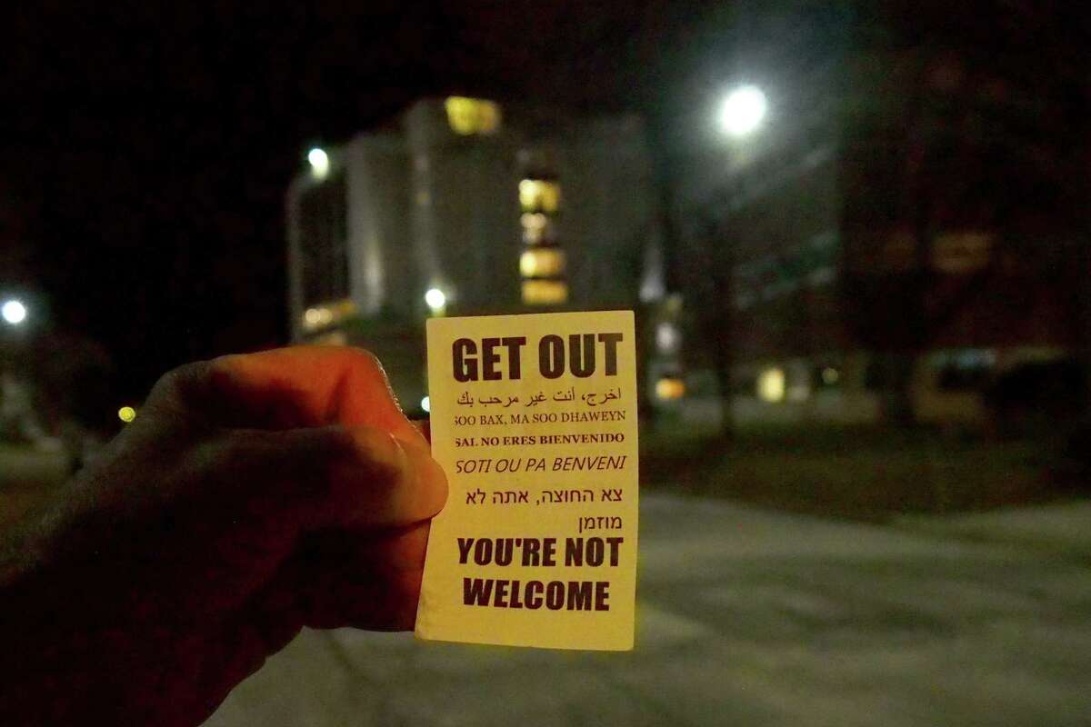 One of several leaflets telling immigrants to get out was found on the walkway outside of the University of Bridgeport's John J. Cox Student Center in Bridgeport, Conn., on Tuesday January 7, 2025. Connecticut Attorney General William Tong, Bridgeport Mayor Joe Ganim, Bridgeport Police Chief Roderick Porter, Acting Superintendent of Schools Royce Avery and others spoke at an 'Immigration Community Conversation' inside the student center ahead of Donald Trump's return to the White House.