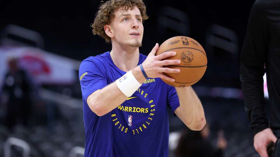 Golden State Warriors’ Brandin Podziemski warms up before playing Indiana Pacers during NBA game at Chase Center in San Francisco on Monday, December 23, 2024.