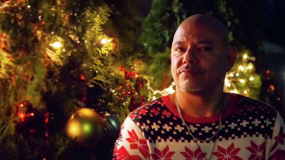 Juan Quiroz, a deported U.S. veteran, poses for a portrait outside his mother’s home during a family Christmas gathering in Overland, MO, Wednesday, December 25, 2024. Quiroz, a U.S. military veteran who was deported and then allowed to return to the U.S. temporarily under a Biden parole program called ImmVets, is now once again afraid he will be deported and have to leave the country under a second Trump term.